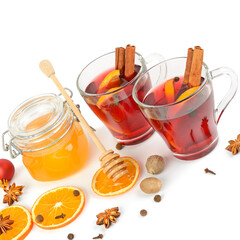 Mulled wine, orange and spices isolated on white background.