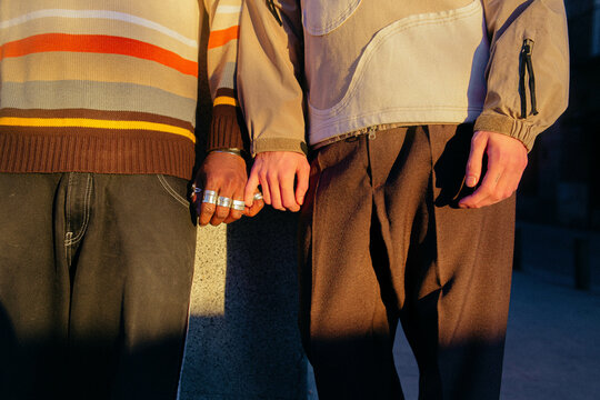 Couple holding hands.