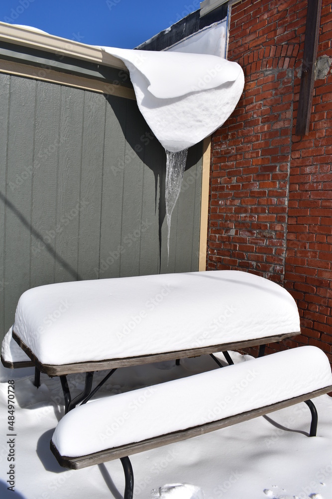 Sticker Icicle Hanging Over a Snowy Picnic Table