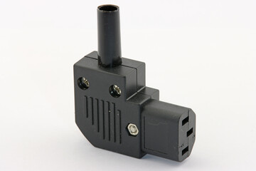 A connector for connecting the power supply of equipment in close-up on a white background.