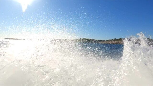 Bow wave of boat on sea in slow motion. Moving, travel, going, speed.