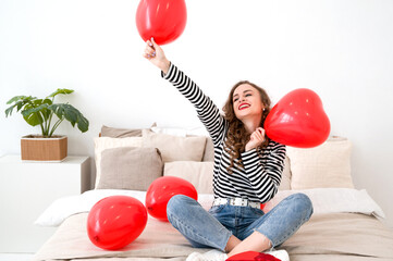 Funny female holding balloons. Celebration of valentine's,women day.Anniversary,birthday