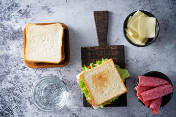 Sandwich with sausage, cheese and tomato for lunch