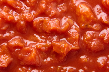 Chopped tomatoes in tomato juice food background