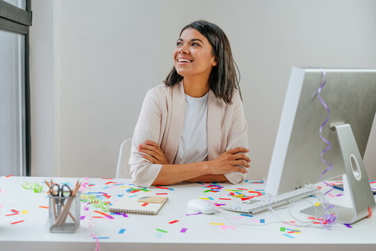 Young Business Woman Having Fun Time Catching Confetti