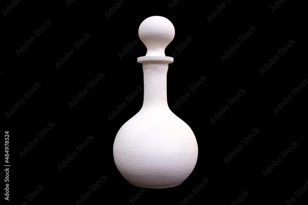 Wall mural white plaster jug isolated on a black background