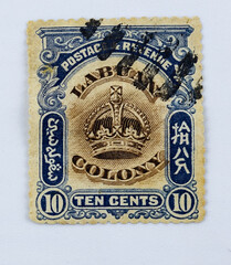 Fototapeta na wymiar Labuan colony, vintage stamp, showing crown and coat of arms, 10 cents. 