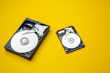 Hard disk drive and open cover. Computer hardware, hard disk, storage device. Detail of the inside...