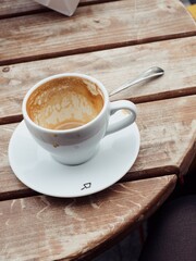 Fototapeta premium Empty coffee cup on a round wooden table 