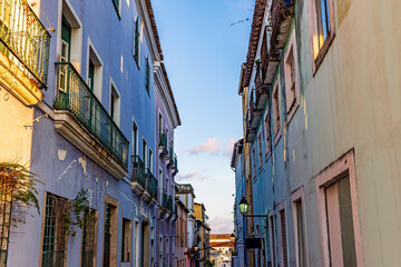 Pelourinho street in Salvador, Bahia with its old colonial-style houses and weathered colored facades and balcony