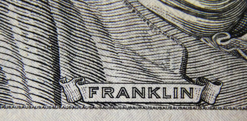Macro showing the detail of a United States $100 bill.
