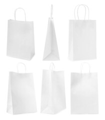 Set with paper bags on white background