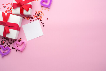 White boxes with gifts on a pink background. St. Valentine's Day. Fluffy hearts. Sheet for text. Concept of love and spring. Top view, background, copy space