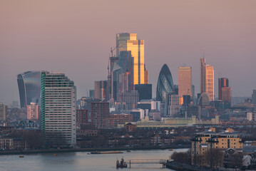 LONDON, JANUARY 30, 2022 - Epic sunrise view of City Square Mile in London at sunrise with beautful soft light and all landmark building visible