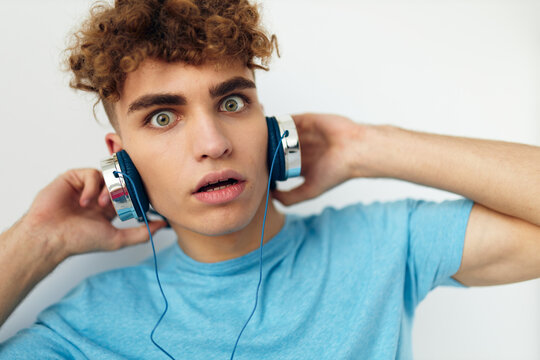 handsome young man music technology entertainment isolated background