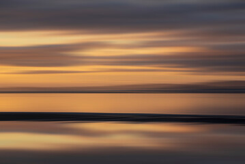 Beautiful Intentional camera movement image of vibrant colorful sunset landscape