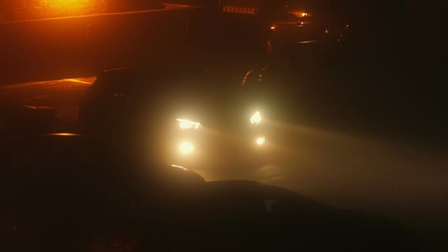 Car Lights Turned On In Thick Mist At Night