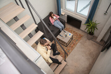 Top view shot of a couple resting at their hotel room