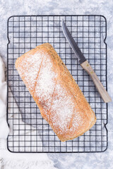 Homemade no knead sandwich bread on cooling rack, ready to eat, vertical, top view
