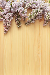 lilac bouquet on wood background