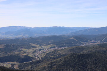 view of the wild mountainous area in the Carpathians from a height in the haze