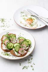 Keto Toasts with cucumber, egg, mozzarella and microgreens.