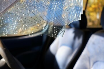 broken window glass at the front seat of a car