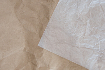 Abstract brown recycled crumpled paper and crumpled tracing paper.Selective focus.
