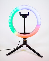 Ring lamp on a small tripod. Red, green and blue light.