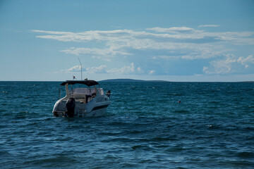 Naklejka premium Small luxurious yacht moored at sea