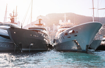 Private super yachts moored in Monaco harbour sunny day Monaco yacht show luxury lifestyle	 - obrazy, fototapety, plakaty