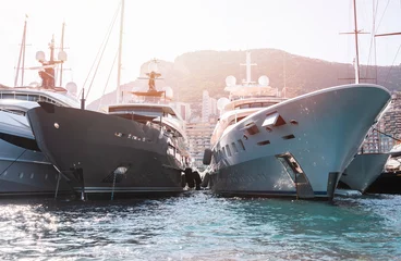 Papier Peint photo Europe méditerranéenne Private super yachts moored in Monaco harbour sunny day Monaco yacht show luxury lifestyle 