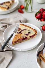 French quiche with strawberries. Traditional French pie. Open berries pie. Seasonal berries