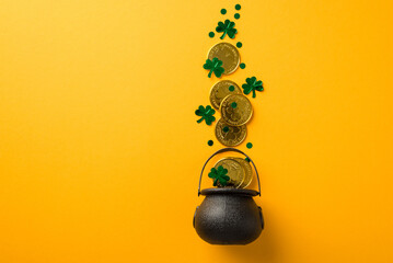 Top view photo of st patrick's day decorations shamrocks confetti and gold coins flying out of pot...