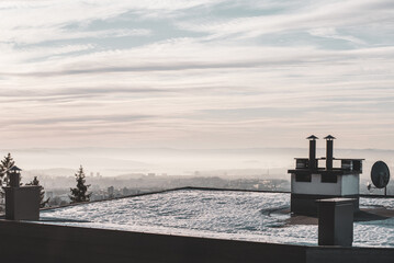 Winter landscape view from the roof of a house