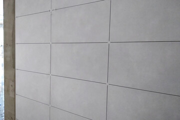 Wall ceramic tiles installation on mortar glue.