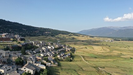 Fototapeta na wymiar survol du vieux village des angles dans le massif des Pyrénées en Occitanie dans le sud de la France