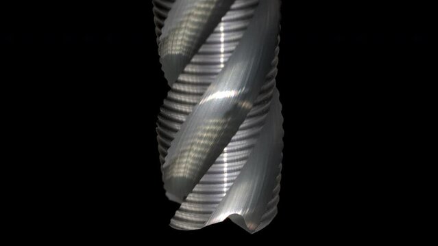 Super slow motion of rotation of a four flute solid carbide end mill. Close Up Zoom. Milling cutter. Mechanical tools. professional tool concept. cuttin tools. metalworking industry.