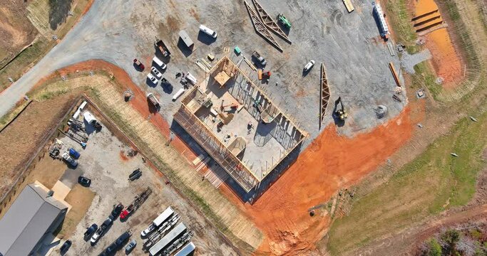 Aerial top view the timber frame beam framework house stick built home under construction new build with wooden truss