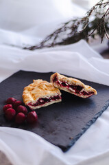 traditional cherry pie on a dark plate