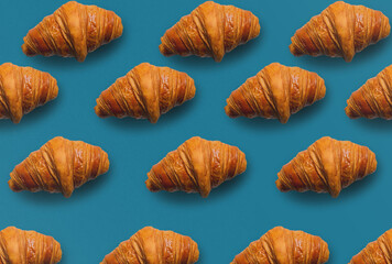 Horizontal croissant pattern with blue background.