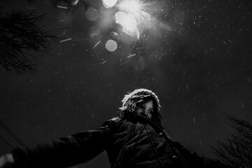 Girl in snow at night