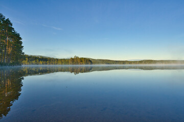 beautiful swedish lake in summertime with a blue sky