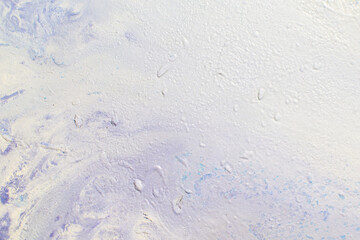 abstract creative background: oil paint frozen in a container after dilution, light color toning, short focus.