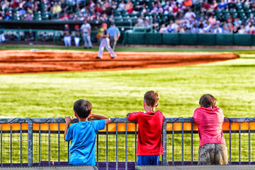 Boys watching baseball.