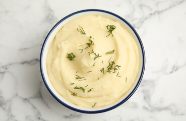 Freshly cooked homemade mashed potatoes on white marble table, top view