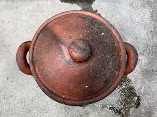 Dirty old tin can of clay pot