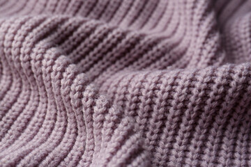 Beautiful violet knitted fabric as background, closeup