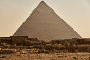 The pyramid of Khafre in a misty haze with ruins in the foreground.