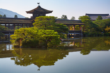 Fototapeta na wymiar The Taihei-kaku is Hashidono (covered bridge) in the garden of Heian-jingu Shrine. Kyoto. Japan